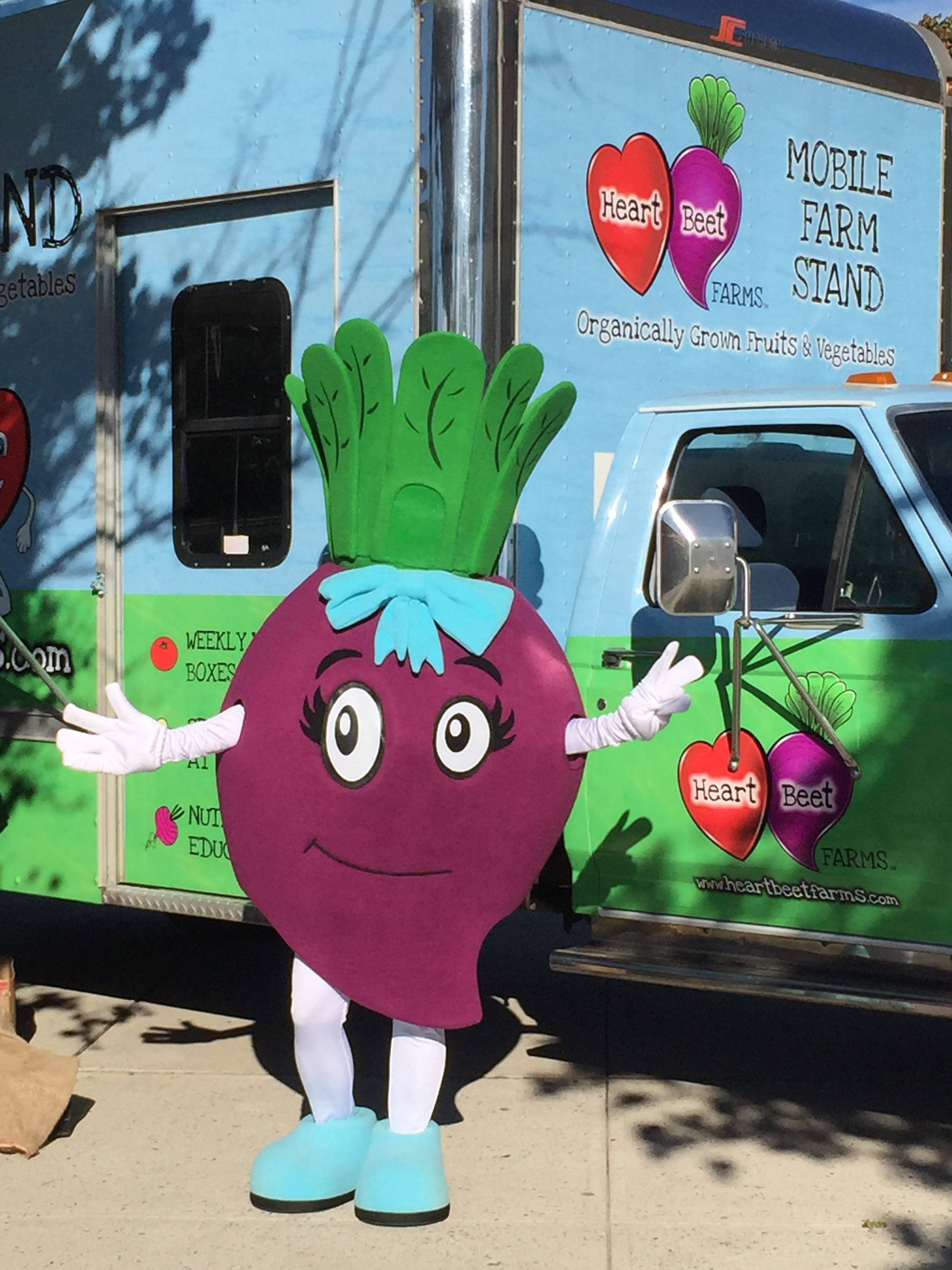 Beet in front of HeartBeet Farms Mobile Farm Stand